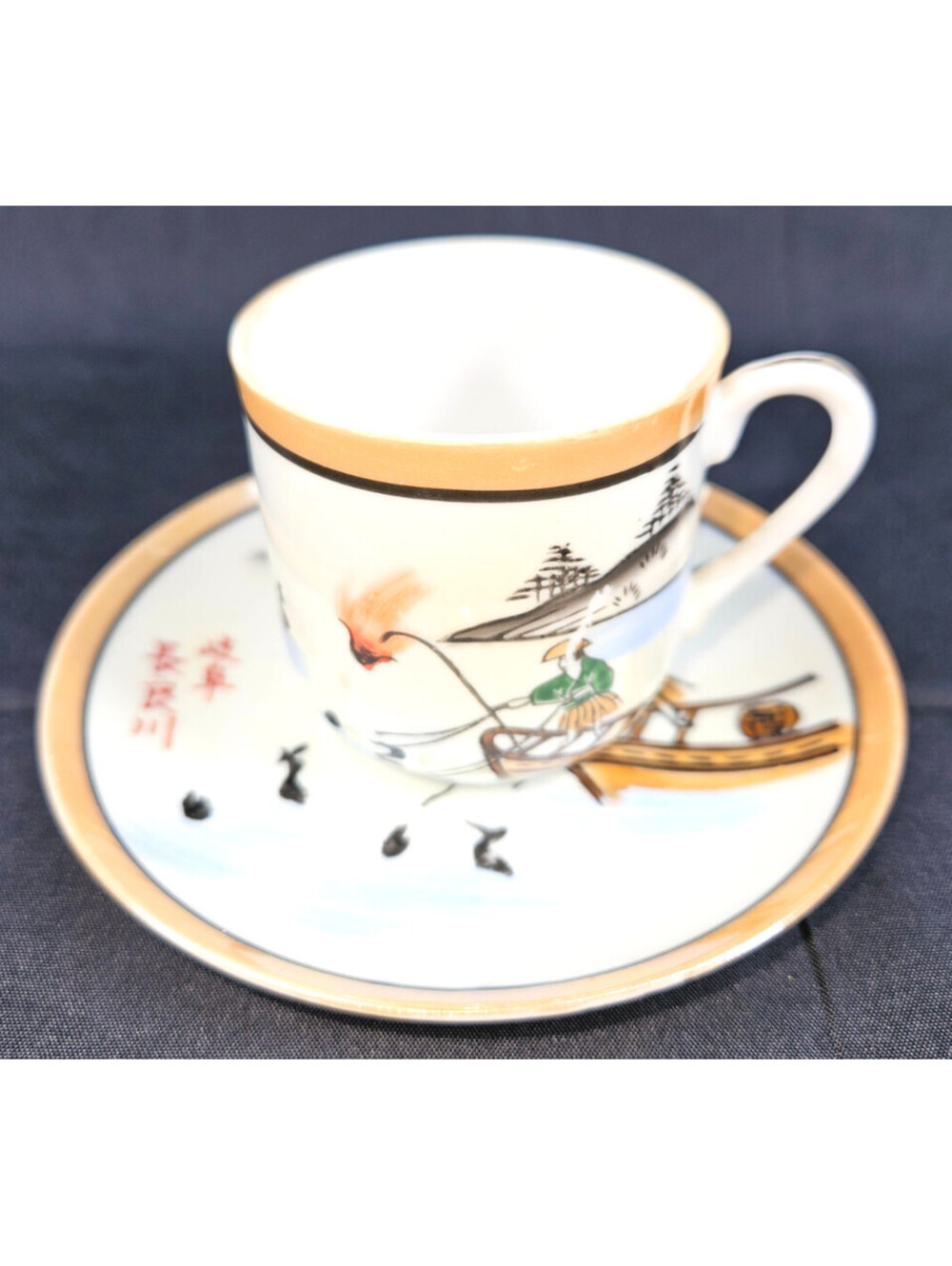 Japanese Porcelain Demitasse Cup & Saucer W/A Scene Fishing For Cormorants